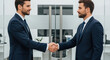 © True Stock - Business Agreement: Two Successful Businessmen Shaking Hands in Modern Office