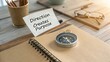 © ConceptExpert - Direction Creates Purpose with Compass and Notepad on Wooden Table