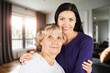 © BillionPhotos.com - Happy woman hug senior patient at retirement home.