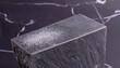 © Asmat - Dark Grey Soapstone Block with Powder Highlight on Marble Background