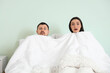 © Pixel-Shot - Shocked young man with his mistress lying in bed. Cheating concept