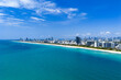 Miami beach with turquoise waters. Aerial view of sandy coastline and waves. Tropical Miami Beach scene with sandy beach. Oceanfront of South Miami. Panoramic of Miami Beach.