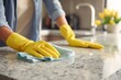 © Mykola - Cleaning Granite Countertops Concept in Kitchen during Covid-19 with Fresh Gloved Cleaner