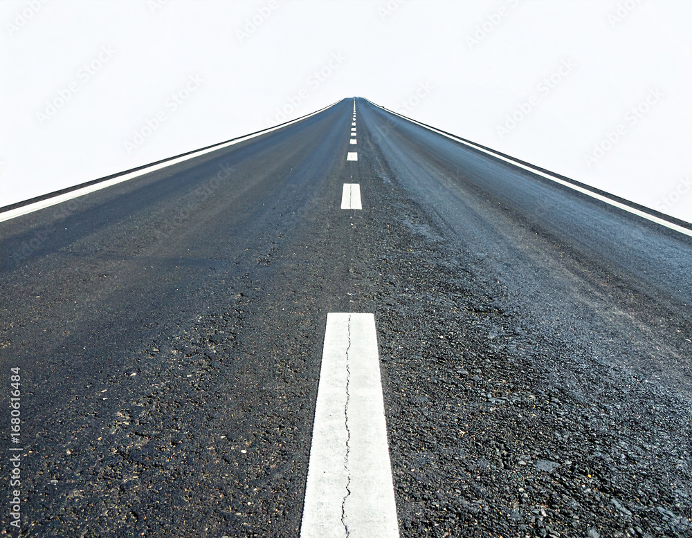 Asphalt road with white lane markings stretching into the distance ...