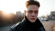 © AI Petr Images - A solemn young Caucasian man in a leather jacket embraces the golden sunrise, invoking World Goth Day introspection