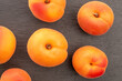 © Oleksandr - Organic ripe apricots on slate stone, macro, top view.