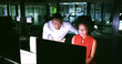 © peopleimages.com - Night, help and business people on computer in office for finance review, budget planning and report. Corporate, teamwork and man with woman on pc for working late, discussion and proposal feedback