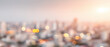 © praewpailyn - Blurry cityscape background with warm sunlight and glowing bokeh lights creates soft urban atmosphere perfect for modern design or presentation use