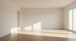 © Nokar - An empty, unfurnished room with white walls and a light wood floor, illuminated by bright sunlight from a large window.