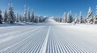 © Budi - Perfectly Groomed Corduroy Ski Slope Leading to Distant Mountains