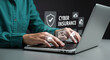 © Boom Boy - Person using laptop with cyber insurance and security icons hologram protection data