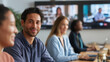 © Kateryna - Split scene showing colleagues collaborating both in person and virtually with some team members physically present while others join via large wall mounted screens. Modern techno