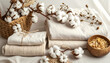 © T. Supisararaviwong - Cozy still life of natural cotton flower, soft textile, and organic home decor. calm and gentle composition of white fabric for comfort