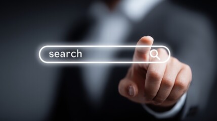 A hand touches a search bar, highlighting the concept of online research and internet usage.