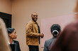 © Johnér - Portrait of male business entrepreneur standing near whiteboard in office meeting room