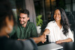 © NDABCREATIVITY - Meeting, partnership and business people shaking hands in the office for a deal, collaboration