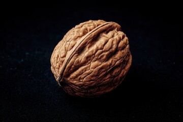 Wall Mural - A whole walnut against a dark backdrop
