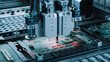 © Gorodenkoff - Robotic Arms Precisely Place Microchips on Circuit Boards, Showcasing Advanced Automation and Accuracy in Electronic Manufacturing Within a State-of-the-art Facility.