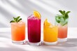 © Дмитрий Баронин - Colorful assortment of refreshing cocktails in clear glasses, featuring vibrant hues and garnishes, set against a soft, light background, perfect for summer gatherings and celebrations