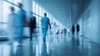 © CStock - A blurred image of healthcare professionals moving through a hospital corridor, symbolizing urgency and care.