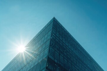 Wall Mural - contemporary structure featuring a blue glass exterior illuminated by sunlight