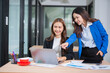 © maeching - Accountants or business people working together on a project. Two female business colleagues are working on computers.