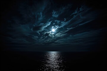 Wall Mural - Night sky illuminated by the moon with clouds over the ocean