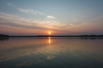 Wall Mural - scenic view of a tranquil lake at dawn or dusk with vibrant sky colors mirrored in the water surface
