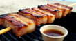 © Visions of Diversity - Philippines – Inihaw na Liempo (Grilled Pork Belly). pork belly slices marinated in calamansi and soy sauce, skewered and grilled