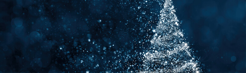 Sparkling abstract Christmas tree made of glittering particles against a dark blue bokeh background; festive digital art.