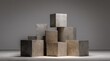 © Hadyan - Stacked concrete cubes on a gray floor