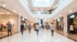 © Novi - A blurred indoor view of a shopping mall featuring people store fronts and overhead lighting