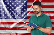 © New Africa - Teacher or student with book against flag of USA. Language school