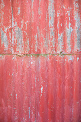 Aged red metal wall
