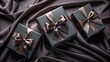 © pixel_girls - Elegant Black Gift Boxes with Brown Ribbons on Silk Fabric