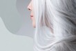 © Aleksey - Elegant Profile of Woman with Long Flowing Gray Hair on Minimalist Background.