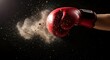 © Bora - Powerful punch with a red boxing glove on black background.