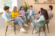© Pixel-Shot - Young man talking at group therapy session