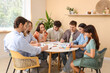 © Pixel-Shot - Group of people drawing at table during art therapy