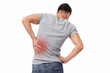 © Prostock-studio - Millennial european man suffer from muscle pain, pressing hand to back, isolated on white background. Kidney disease, sprain, spasm, office syndrome and health problems. Injury and chronic arthritis