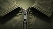 © RENA - Detailed close-up view of a metal zipper and textured fabric collar on a classic olive green jacket, highlighting fashion and textile concepts