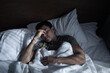 © kieferpix - Tired Man Resting in Bed at Night Feeling Unwell and Stressed restless