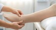 © ViskBx - Applying compression stockings by a healthcare professional helps blood circulation and reduces leg swelling. Medical care for vein health.