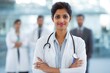 © dex - Confident Female Doctor with Stethoscope and Crossed Arms in Hospital, Healthcare Professional