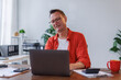 © David - Business man Using laptop computer and working at office with calculator document on desk, doing planning analyzing the financial report, business plan investment, finance analysis concept.