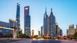 Modern city skyline with tall skyscrapers under clear sky