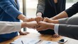 © Happy Stock Images - Business people fist bumping together