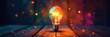 © Prasert - Rainbow hues burst around glowing bulb on wood , fantasy, explosion