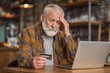© Vlad - Elder Fraud. Concerned Senior Man Worried About Financial Safety and Online Payment Security