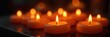 © Wimonrat - Close-up of several flickering candle flames, warm yellow light illuminating the wax, creating a cozy and intimate atmosphere  Perfect for holiday, relaxation, or spiritual themes ,  yellow,  winter
